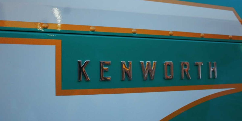 close-up of Kenworth emblem on the exterior of a semi truck