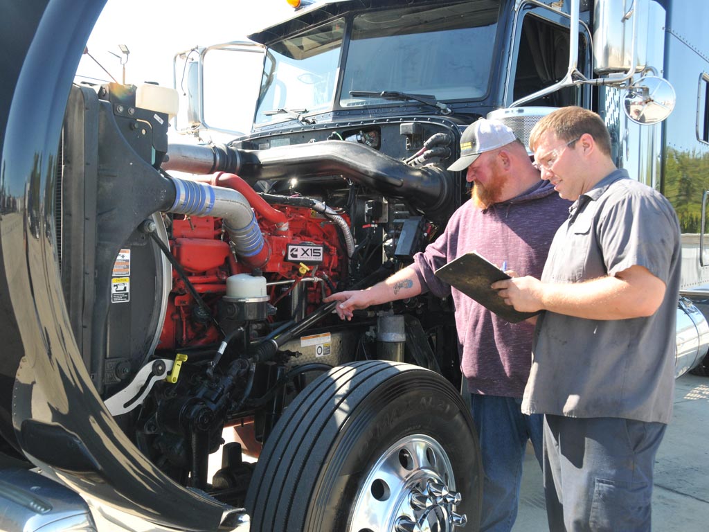 Certified appraiser inspecting used semi-truck